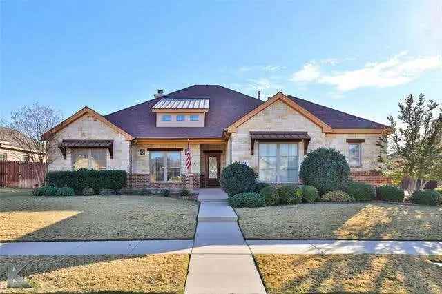 Buy House in LoneStar Estates with Stone Brick Façade and Outdoor Kitchen