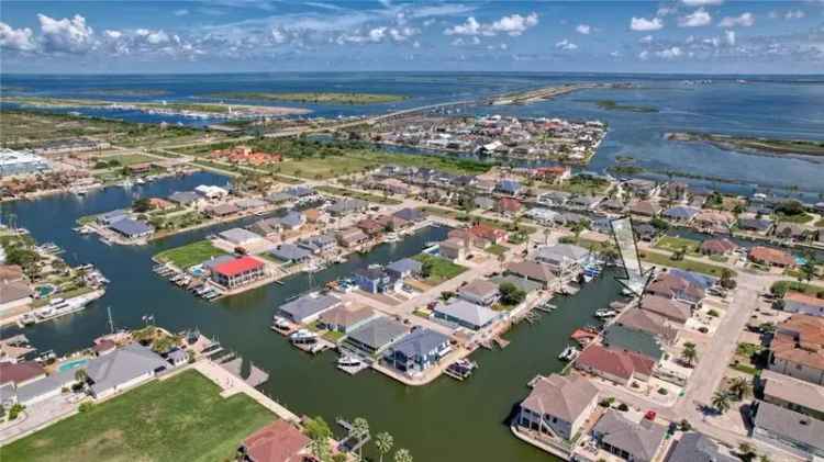 Buy Canal Front Home in Pelican Cove with Boat Lift and Open Layout