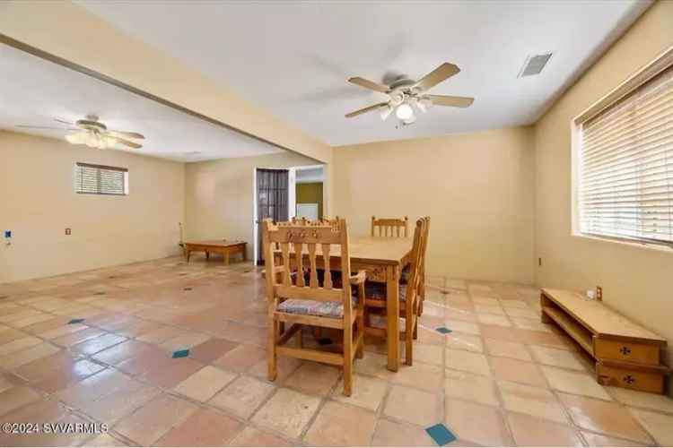 Buy Sante Fe Style Home with Large Garage in Appropriately Sized Lot