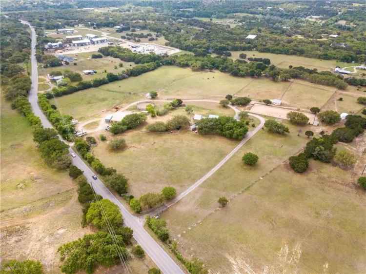 Develop land for sale in Austin with horse barn and event venue potential