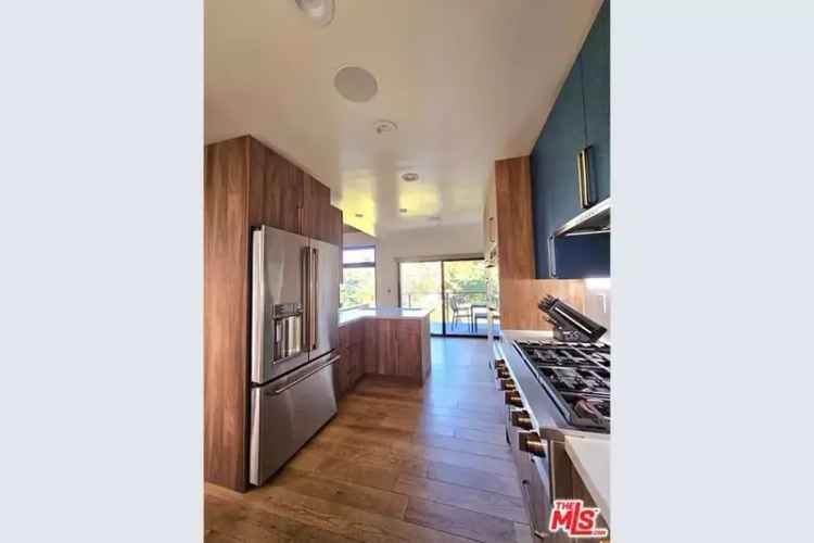 Buy mid century home in Beachwood Canyon with stunning views and modern updates