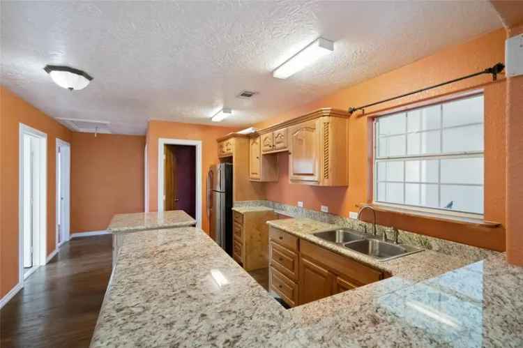 Buy Corner Lot Home with Open Concept Kitchen and Space for Vehicles