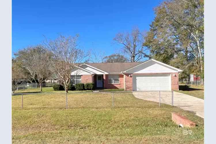 Charming brick home for sale in Elberta with outdoor living features