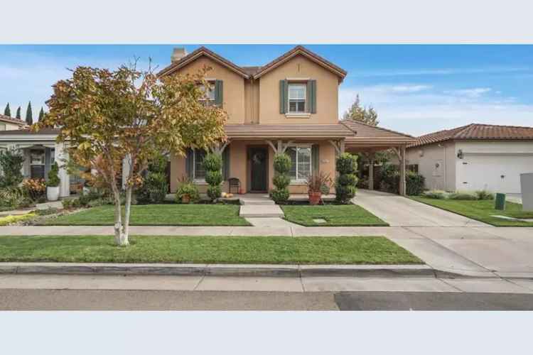 Buy two-story home in Legacy Way with spacious bedrooms and a landscaped backyard