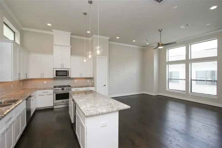 Buy modern home near 610 Highway with EV charger and open floor plan