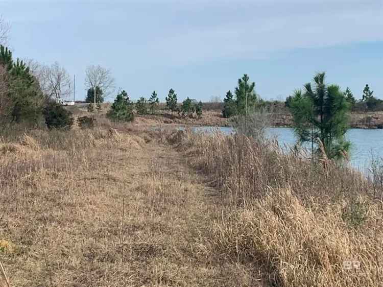 Buy Land in Summerdale AL with Lake and Road Frontage Features