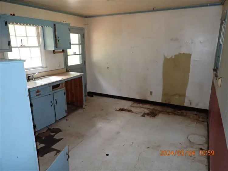 Buy Ranch Style Waterfront House with Fixer-Upper Potential