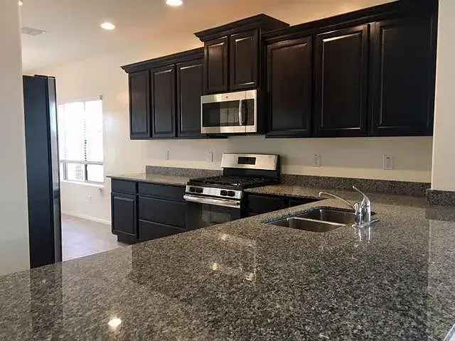 Rent Upgraded Home in Gilbert with 4 Bedrooms and Community Amenities