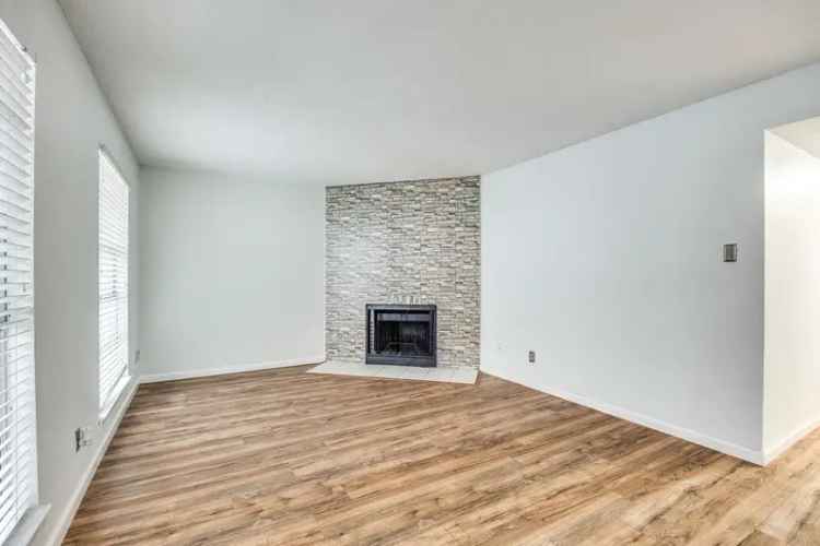 Rent Condo Near Richland College with Updated Kitchen and Fireplace