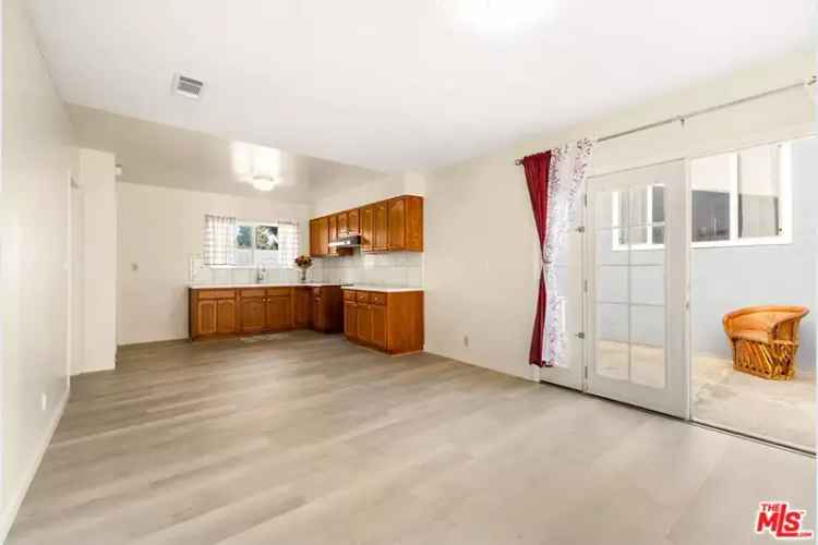 Buy Duplex in Highland Park with Renovated Units and Private Patio