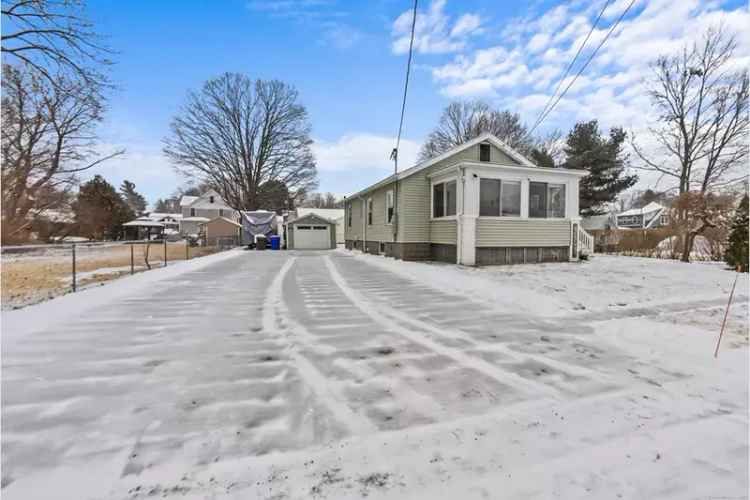 Buy Home in Wallingford with Spacious Living Area and Beautiful Yard