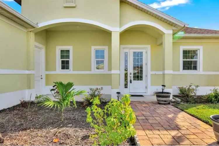 Luxury Buy Canal Front Pool Home with Expansive Lanai and 3 Car Garage