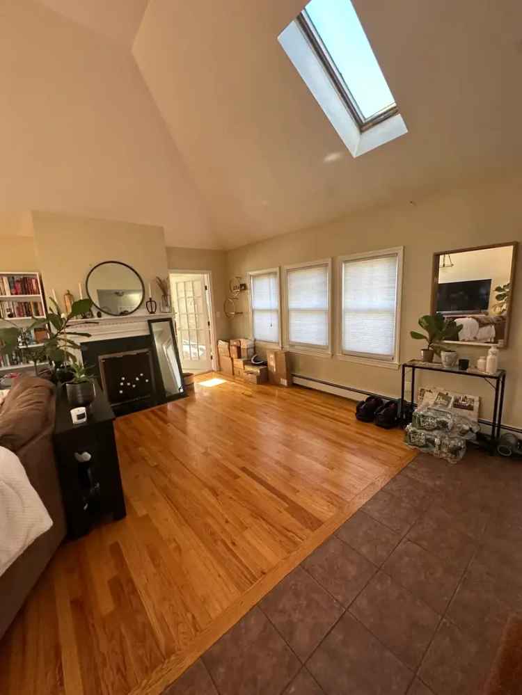 Top Floor Apartment for Rent in West Newton with Sunroom and Parking