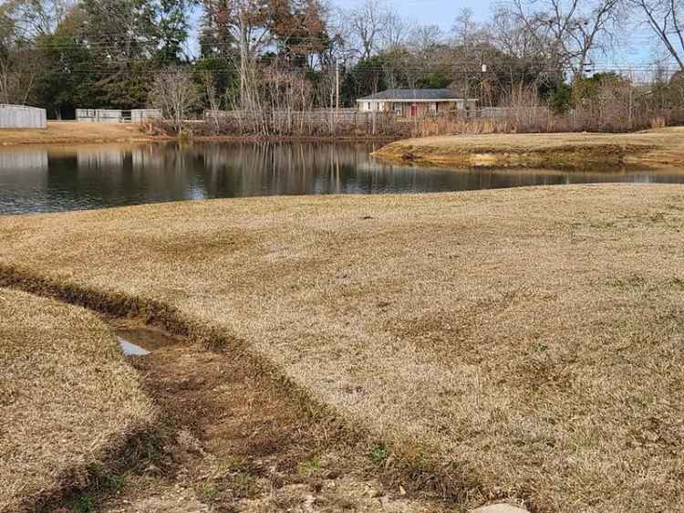 Surveyed Land for Sale in Maplewood Subdivision with Retention Pond Features