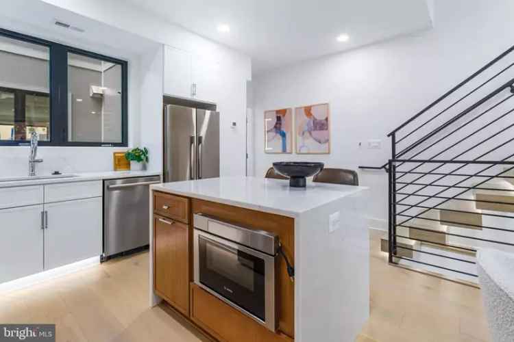 Luxury row home for sale in NOMA with rooftop terrace and gourmet kitchen