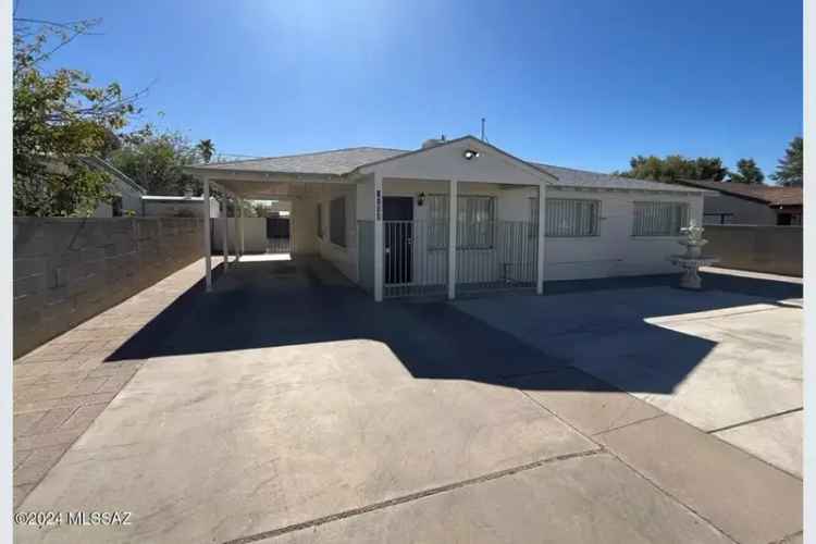 Buy updated home in vicinity of U of A with large backyard and gated parking