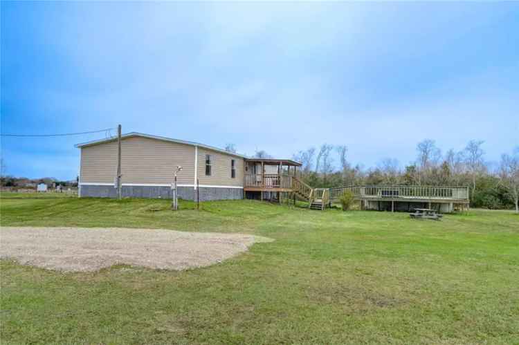 Buy home with 6.7 acres in Anahuac ISD with pool and horse stall