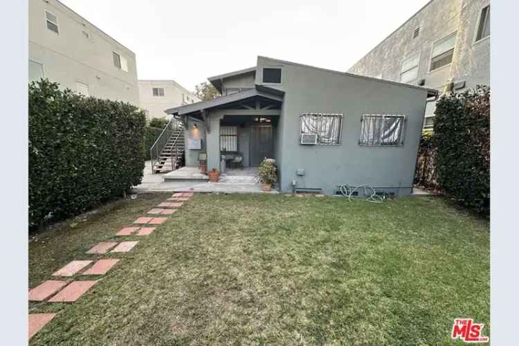 Buy triplex in Hollywood with development potential and private yard