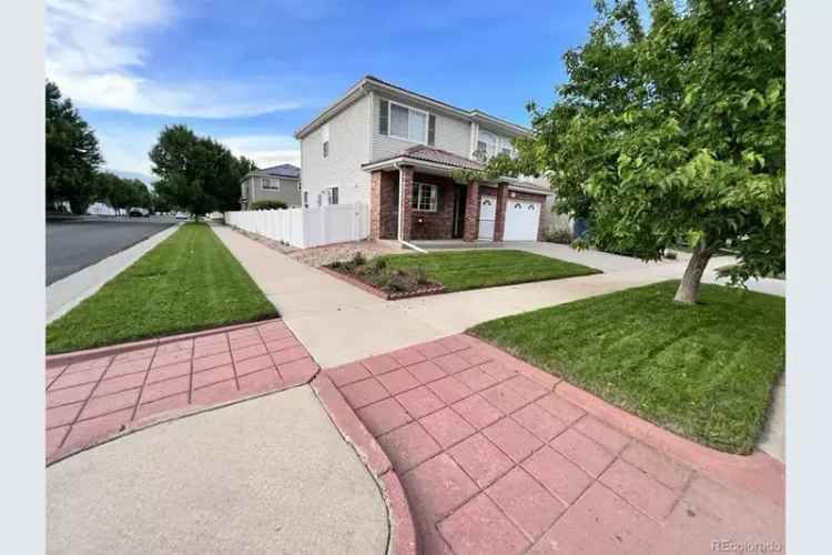 Stunning buy two-story home with a landscaped backyard and modern upgrades