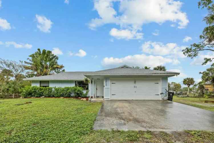 Charming buy house in The Acreage with barn and spacious lot