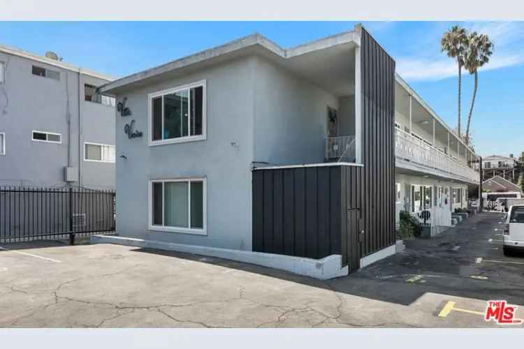 Buy apartment community in Mid-City Los Angeles with renovation potential