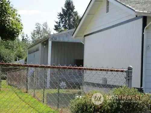 Investors Dream Buy Single Story Home Large Lot with Metal Shop