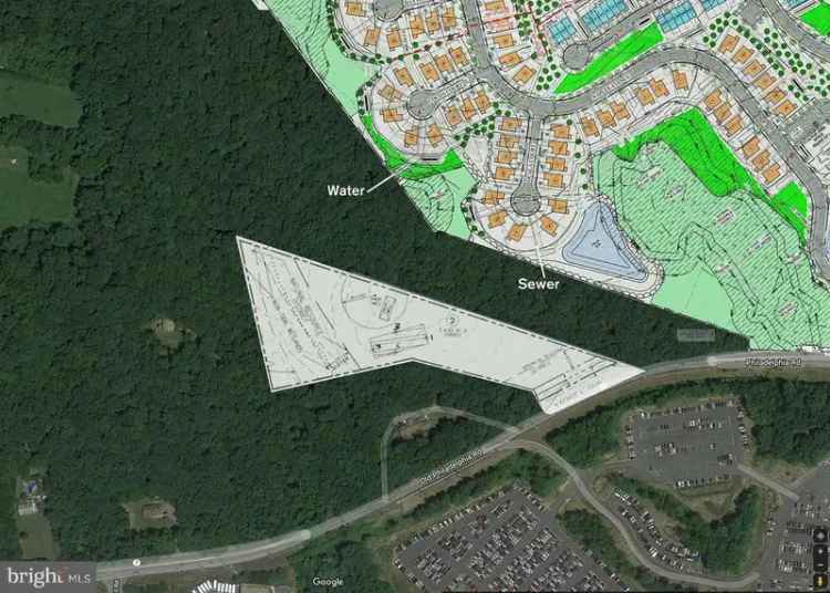 Wooded land for sale offering privacy and future development potential