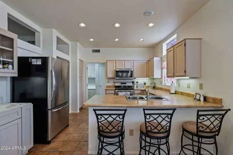 Buy House in Sun City West with Spacious Arizona Room and Golf Course Access