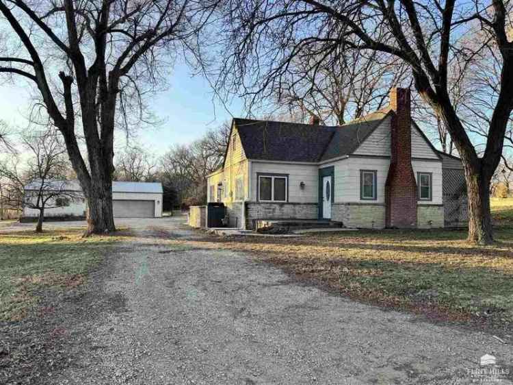 Buy country home with shop and garage on quiet road