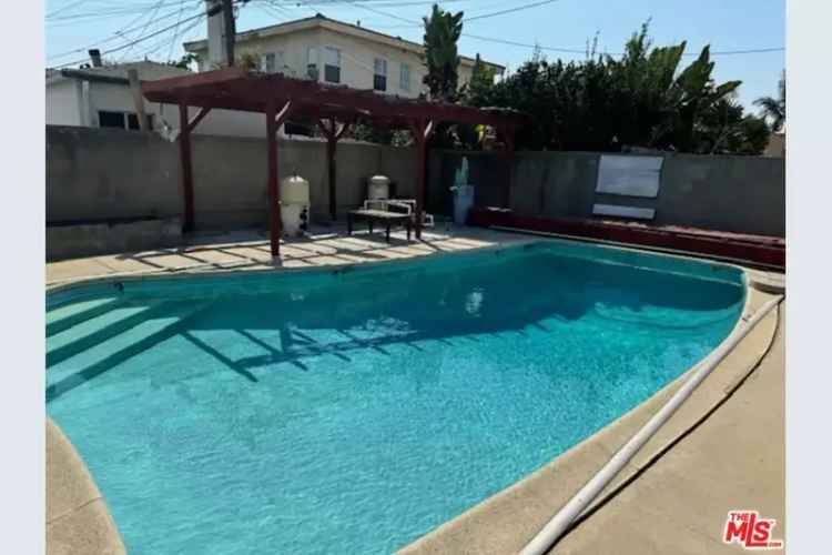 Buy Duplex in Vibrant Mid-City Enclave with Pool and Garage