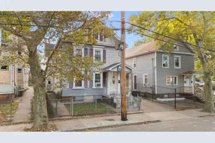 Duplex for sale in New Haven with two spacious units and backyard