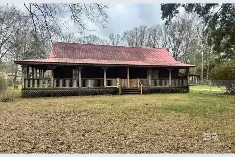 Buy Coastal Log Cabin in Alabama with Investment Potential and No HOA Dues