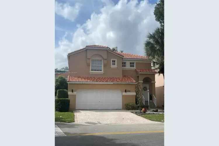 Buy Two Story Home in Knightsbridge Community Coral Springs with Renovated Kitchen