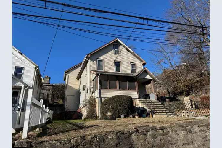 Buy Multifamily Home in Norwalk with Unfinished Attic for Expansion