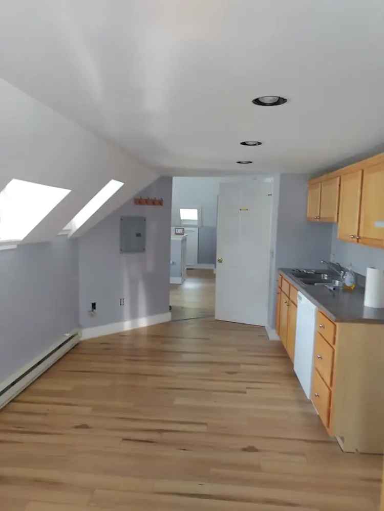 Rent Updated Loft Apartment in Prime Location with Roof Deck and Parking