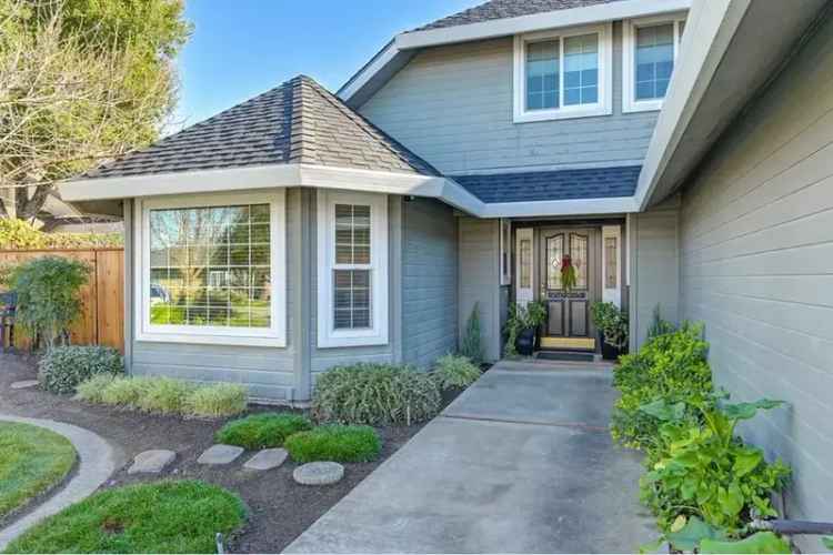 Buy Cozy Custom Home with Pool in a Family-Friendly Neighborhood