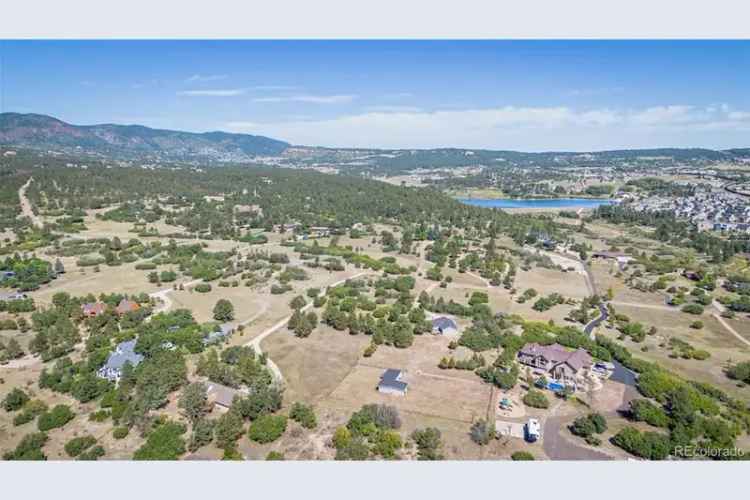 Ranch home for sale in Monument CO with trees and mountain views