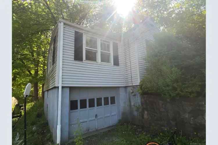 Buy Affordable Housing Property in Torrington with 1.1 Acres Needs Repairs