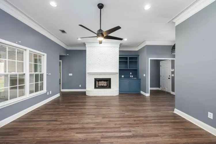 Buy one story home in Phenix City with remodeled kitchen and fenced backyard