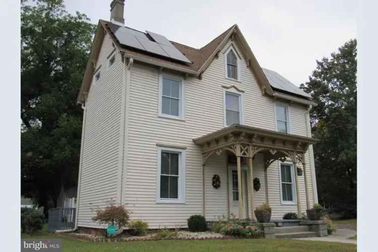 Victorian home for sale in Laurel with first-floor bedroom and large yard