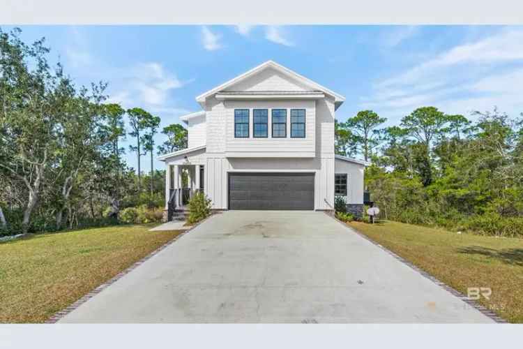 Luxury home for sale on Ono Island with outdoor living space and high-end finishes