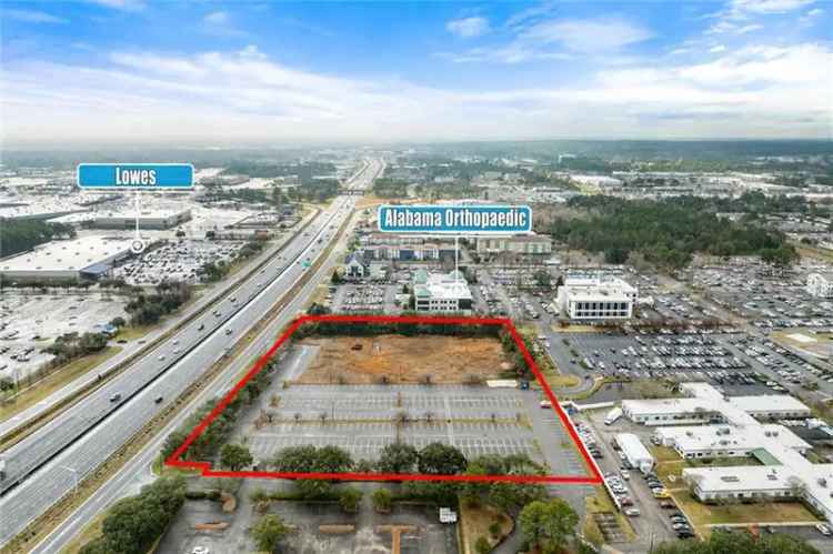 Develop land for sale at I-65 and Dauphin St with ample parking