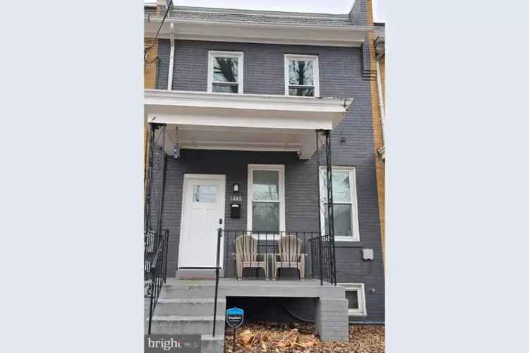 Buy row home in urban location with deck and Capitol views