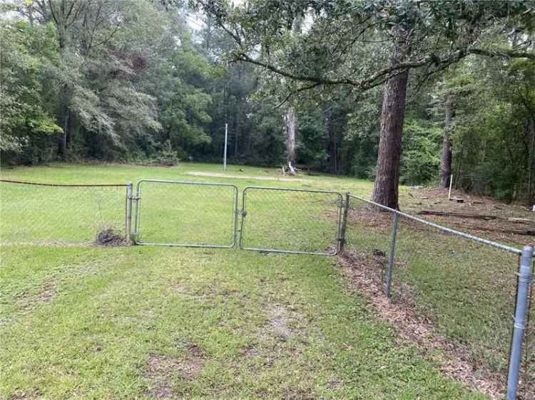 buy building lot in established neighborhood with fenced land