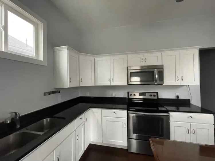 Rent 2 Bedroom Cottage Near Downtown with Private Backyard and Updated Kitchen