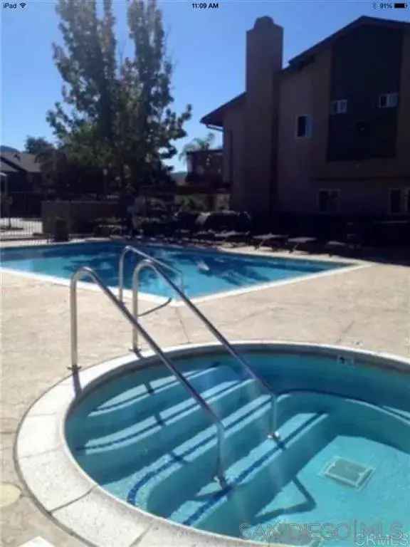 Rent Charming Apartment Unit in a Two Story Townhome Near Community Pool