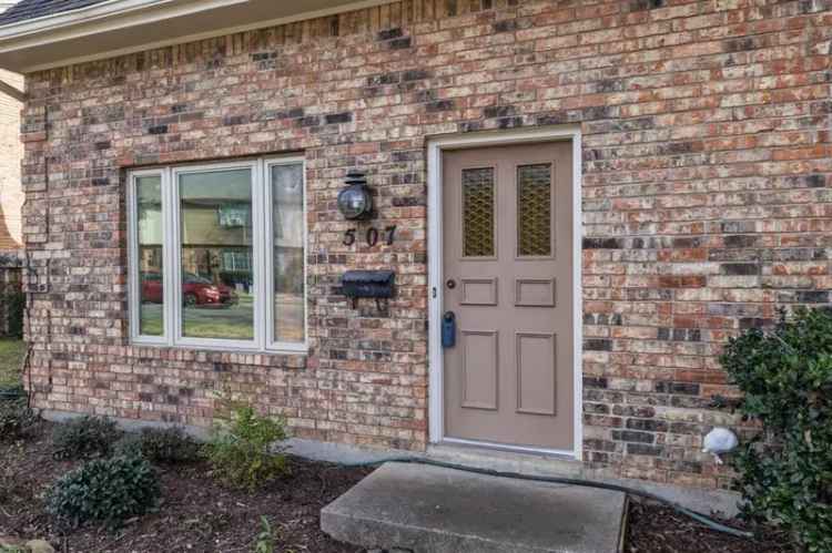 Townhouse For Sale in Graham Square with Spacious Living Areas and Outdoor Patio