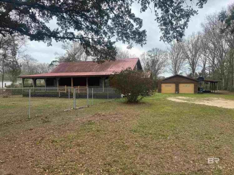 Invest in a Coastal Log Cabin with No HOA Dues in Alabama