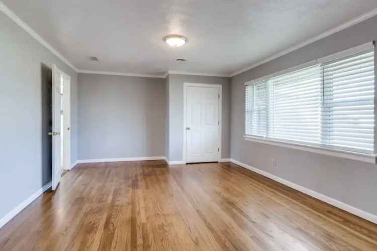 Rent Home in Garland with Spacious Living and Enclosed Sunroom