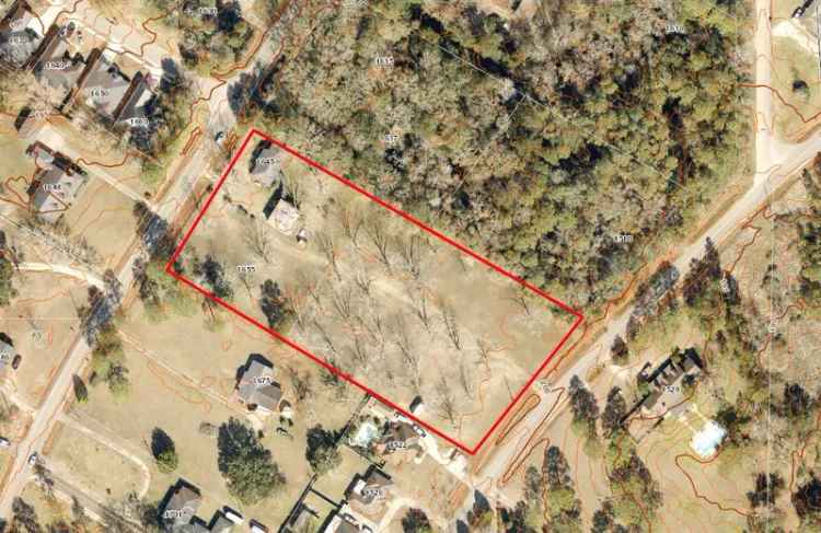 Buy Land and Brick Home in Mobile with Paved Frontage and Potential